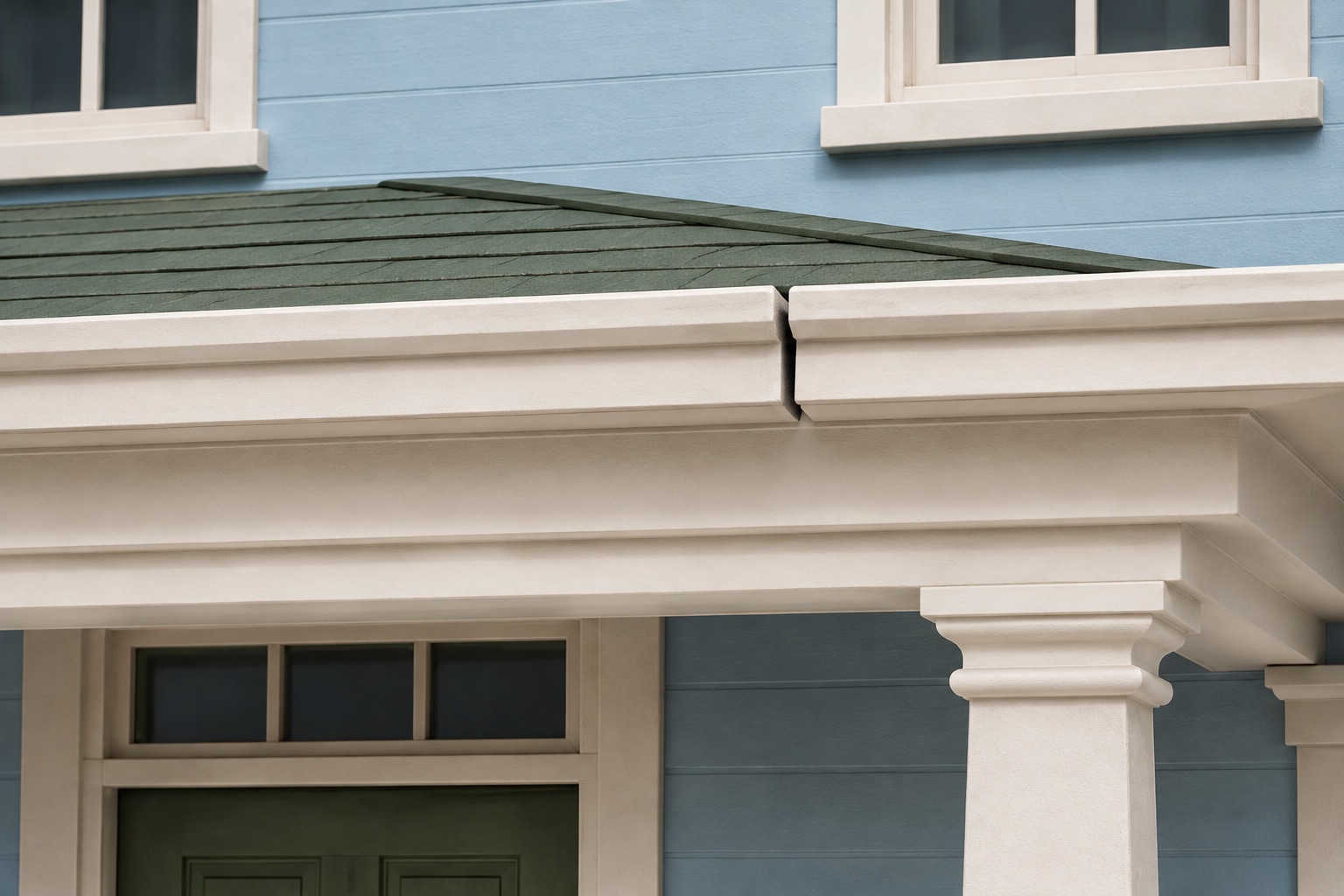 Close-up of the open joint in the cream porch roof trim